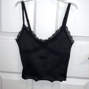 H&M black V-neck crop top with lace details at top, adjustable straps.